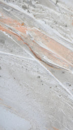 Close view of the flowing texture and warm sand tones in Peace