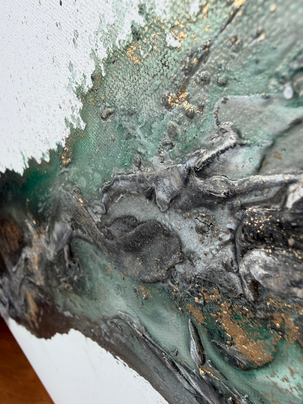 Close view of black, gold and green with a warm brown edge in Rooted 2