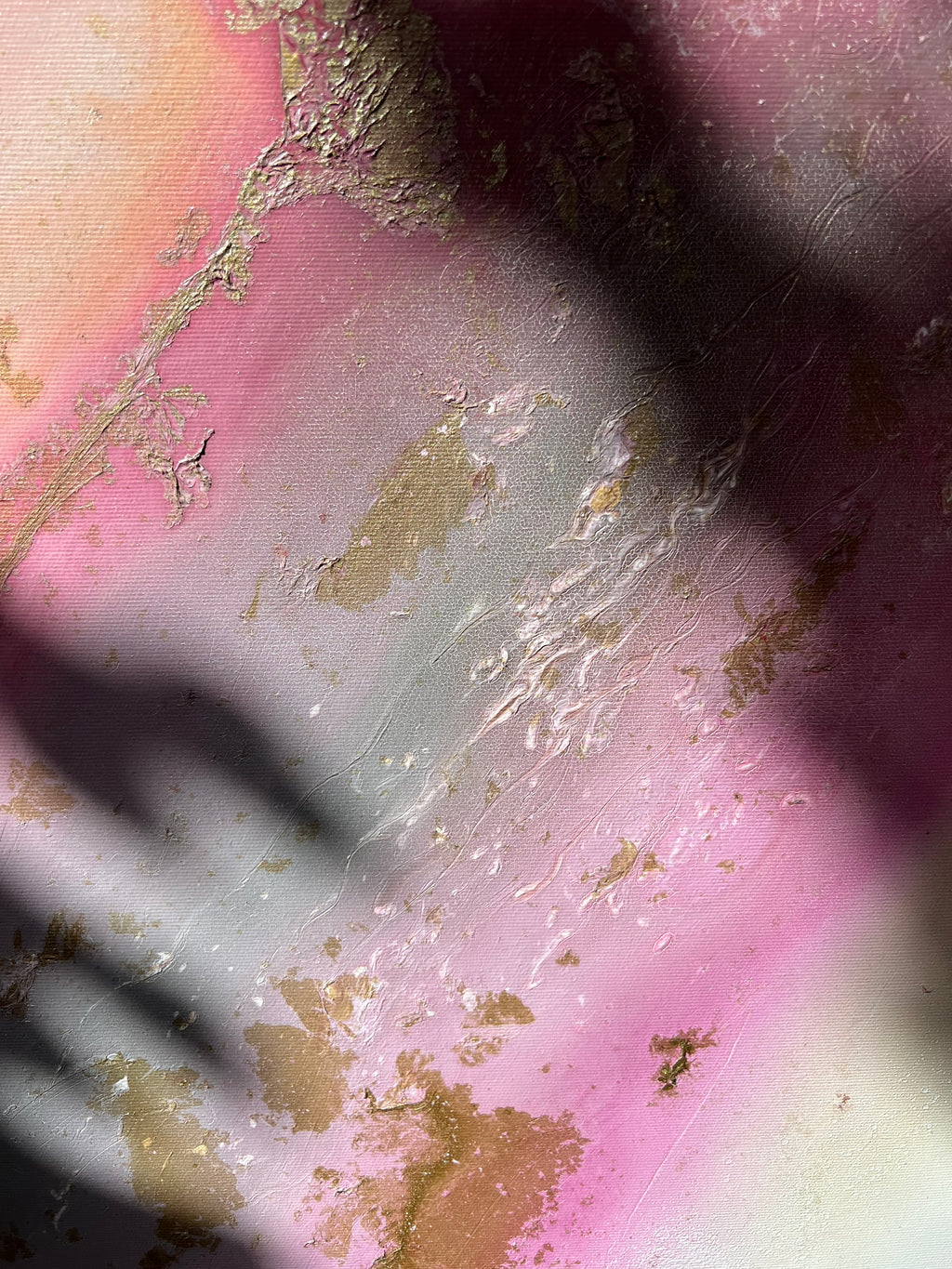 Detail of pink and gold with a soft shadow across Flow