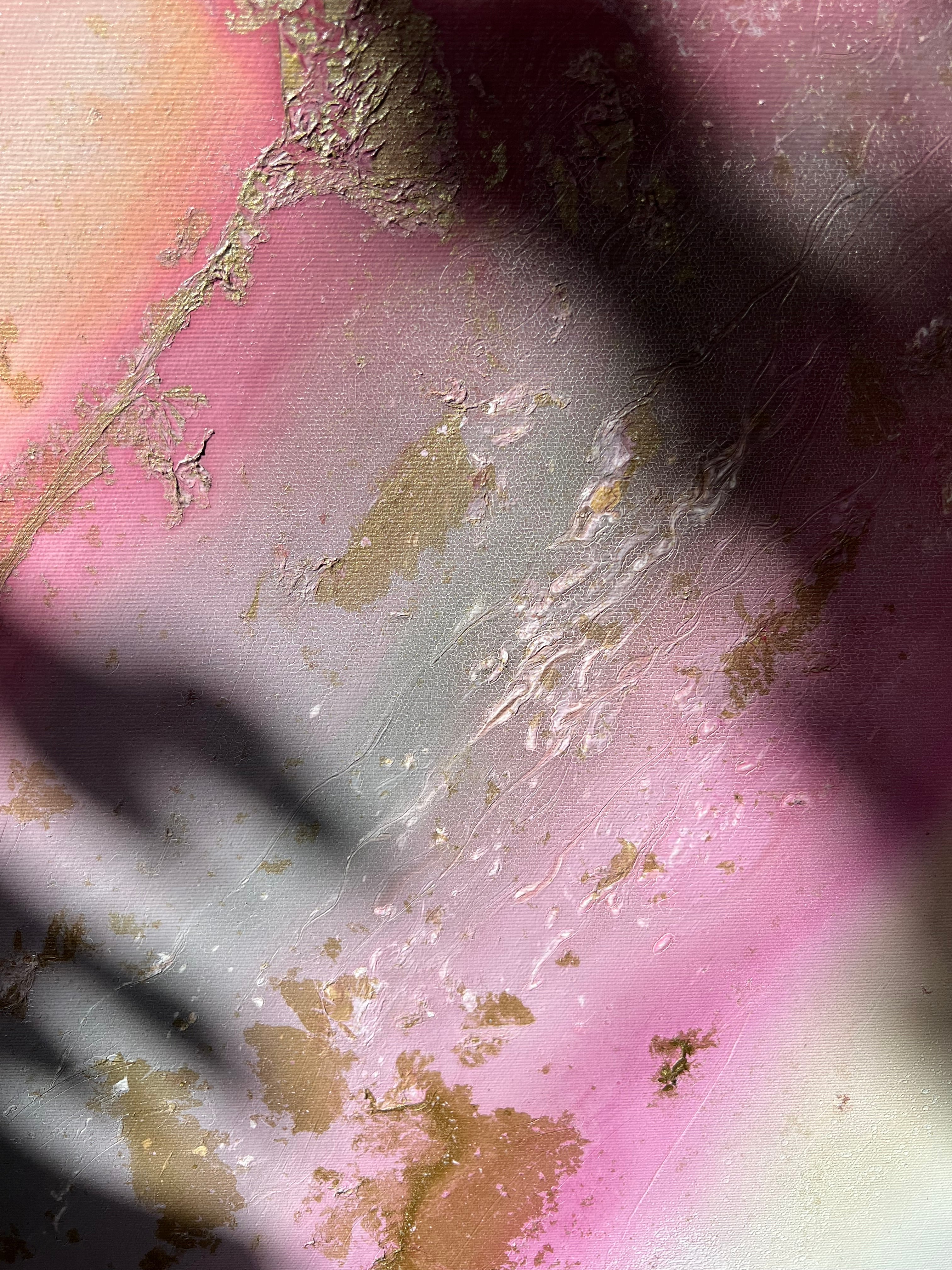 Detail of pink and gold with a soft shadow across Flow