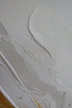 Close-up of the white textured field of Serenity 2, structure paste catching the light