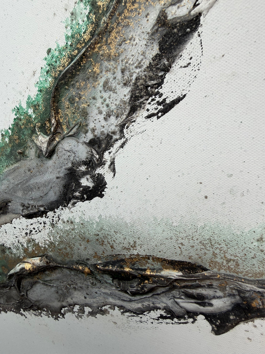 Close-up of black and gold splatters over the white ground of Rooted 2