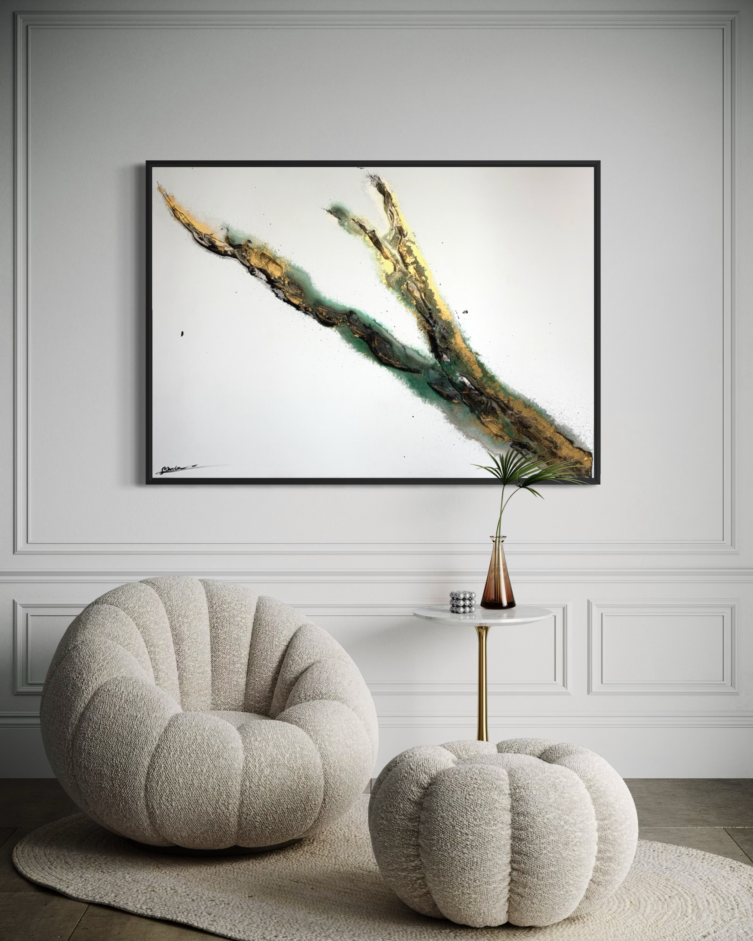 Rooted 1 framed in black on a panelled wall above a bouclé chair and pouf