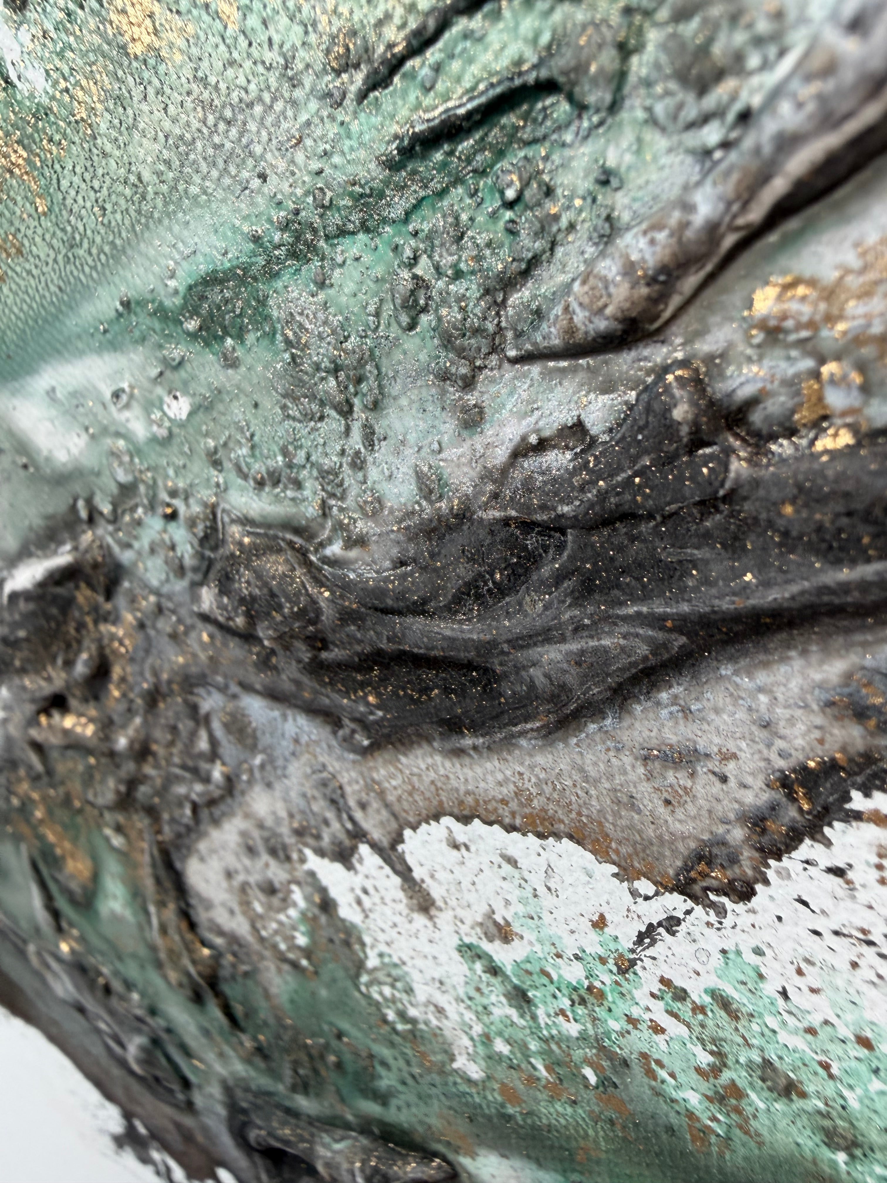 Macro of green, silver and black structure paste in Rooted 2