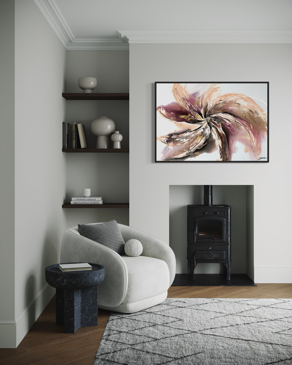 Wildflower framed in black, hanging beside a wood burner in a pale living room with a bouclé armchair