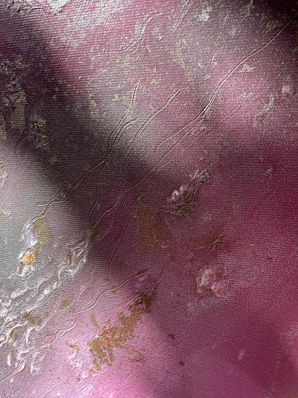 Close-up of mauve and gold spray flecks on the surface of Flow