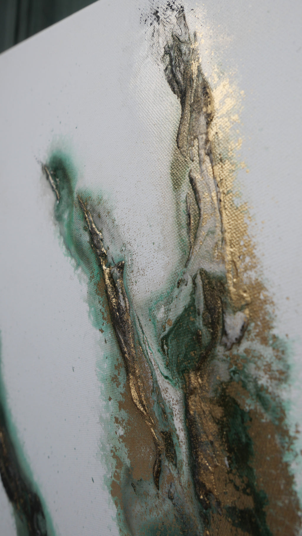 Close view of teal, gold and black layers in Rooted 1
