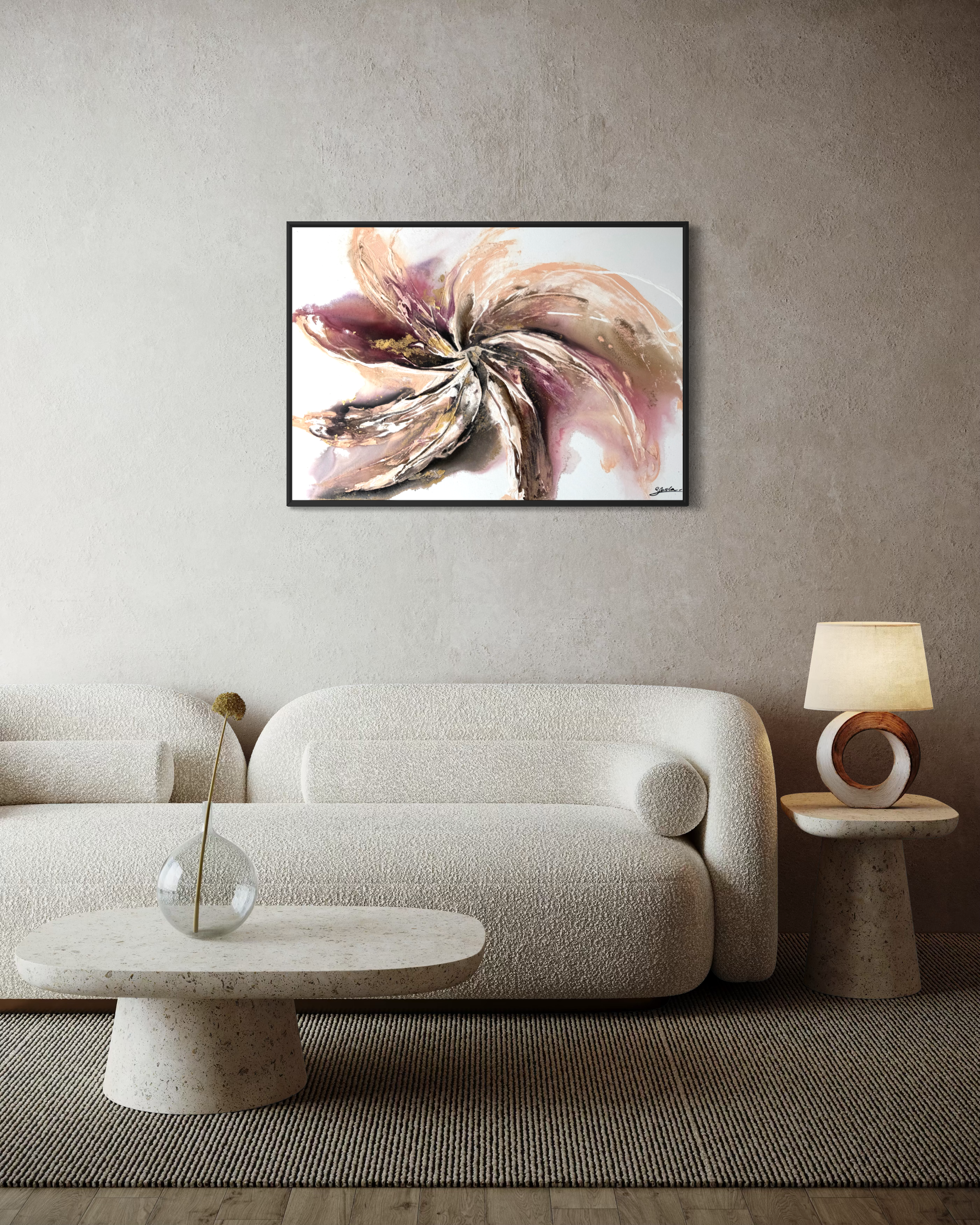 Wildflower hanging above a cream sofa with a table lamp and a round coffee table