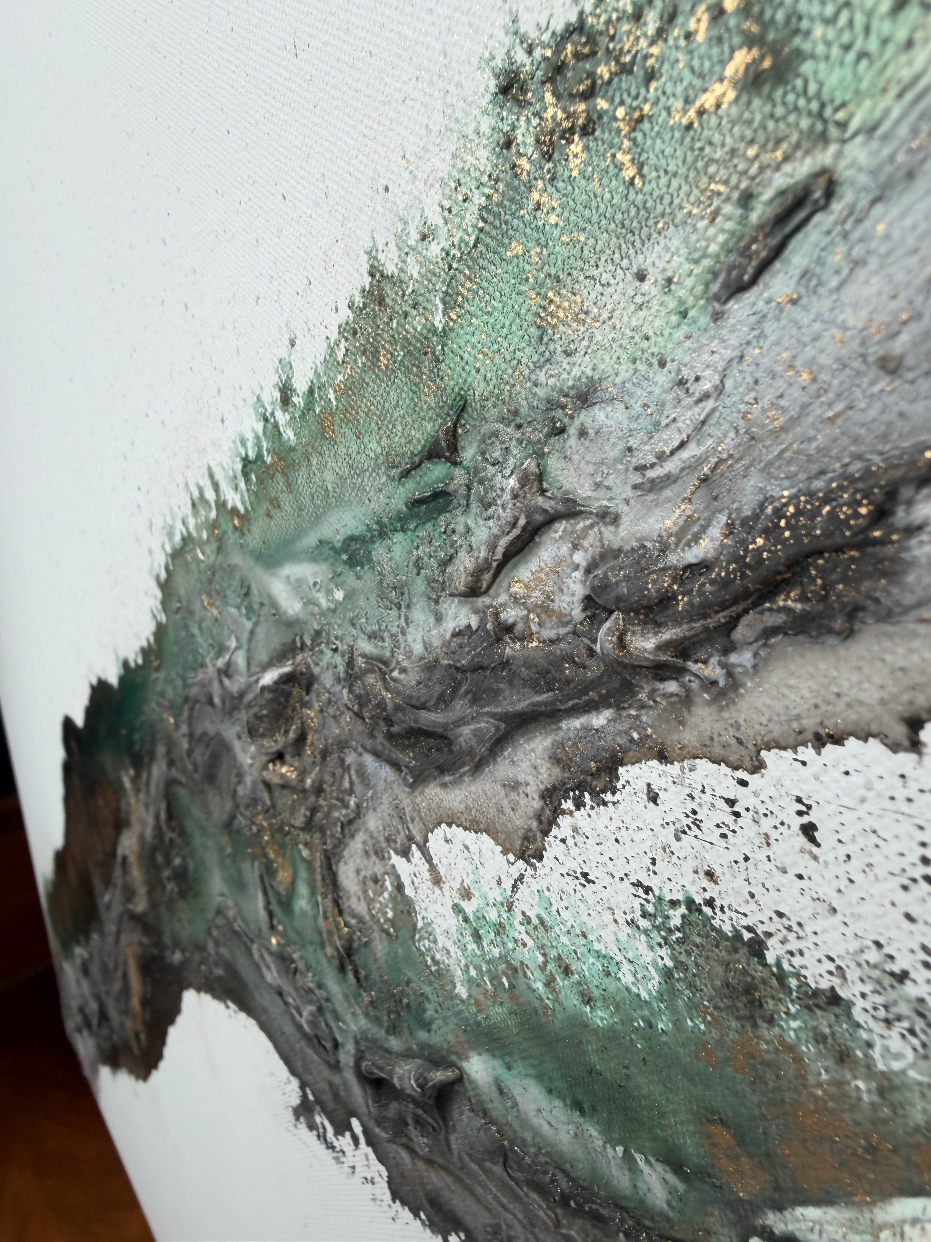 Detail of green meeting silver-grey and black in Rooted 2