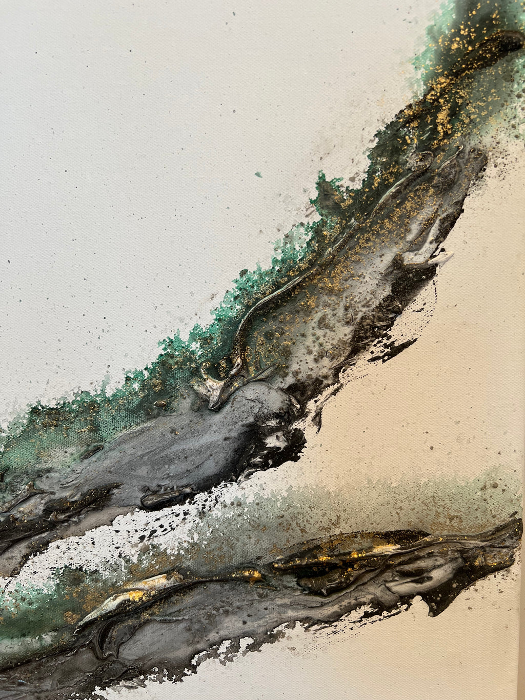 Close-up of gold flecks scattered along the green edge of Rooted 2