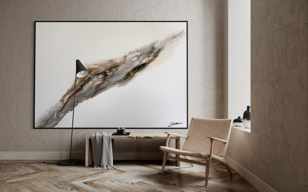 Bedrock on a pale wall in a living room with a floor lamp, wooden bench and armchair.
