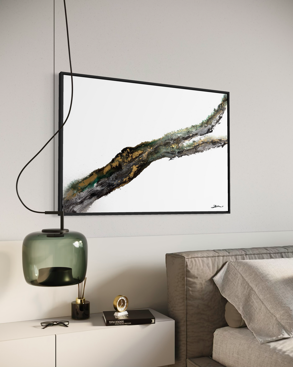 Rooted 2 framed in black above a bed, beside a green glass pendant lamp