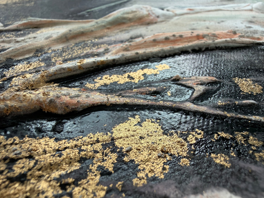Close-up of Unfold where gold pigment sits in the dark ridges of the structure paste