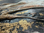 Close-up of Unfold where gold pigment sits in the dark ridges of the structure paste