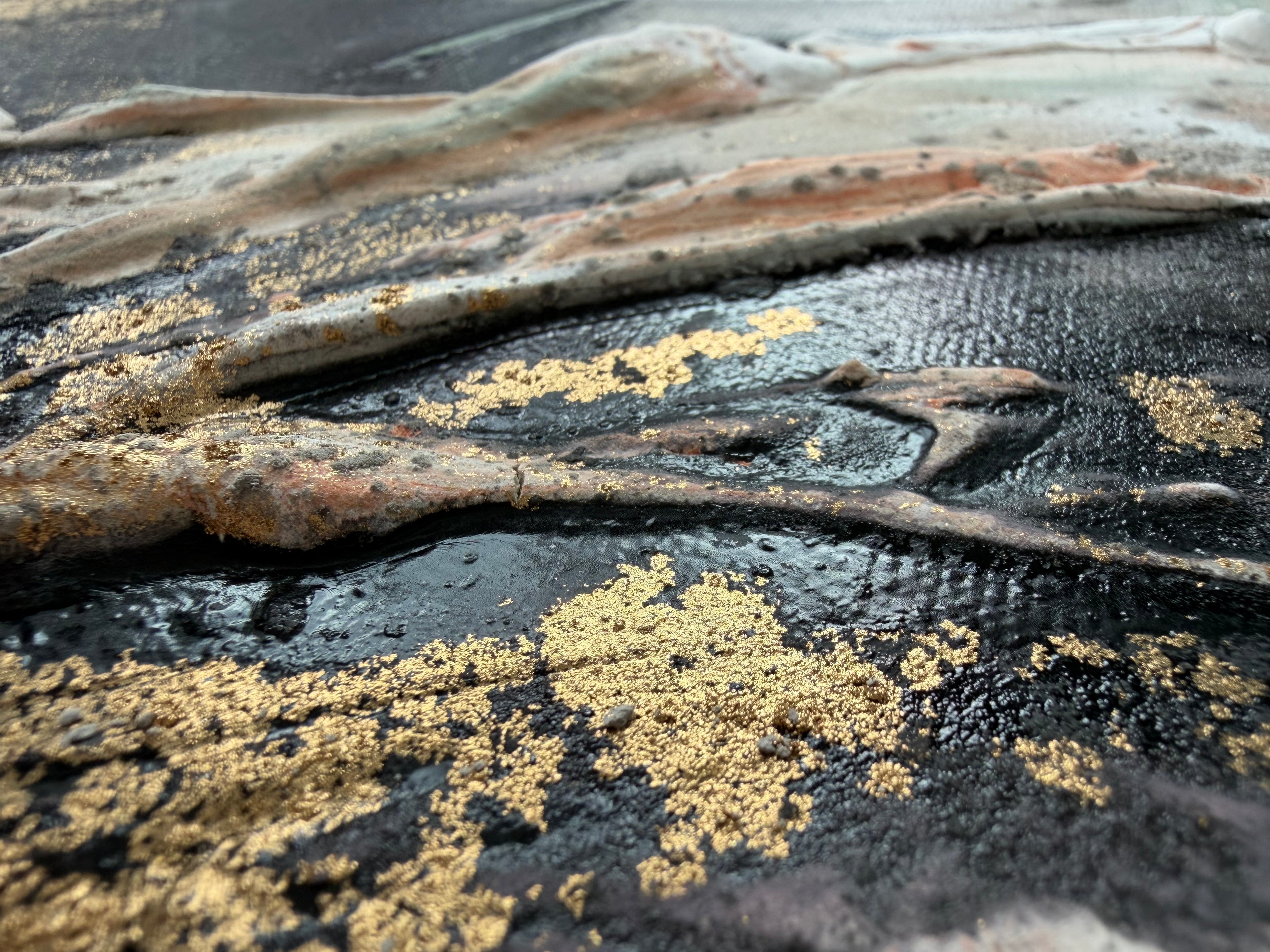 Close-up of Unfold where gold pigment sits in the dark ridges of the structure paste