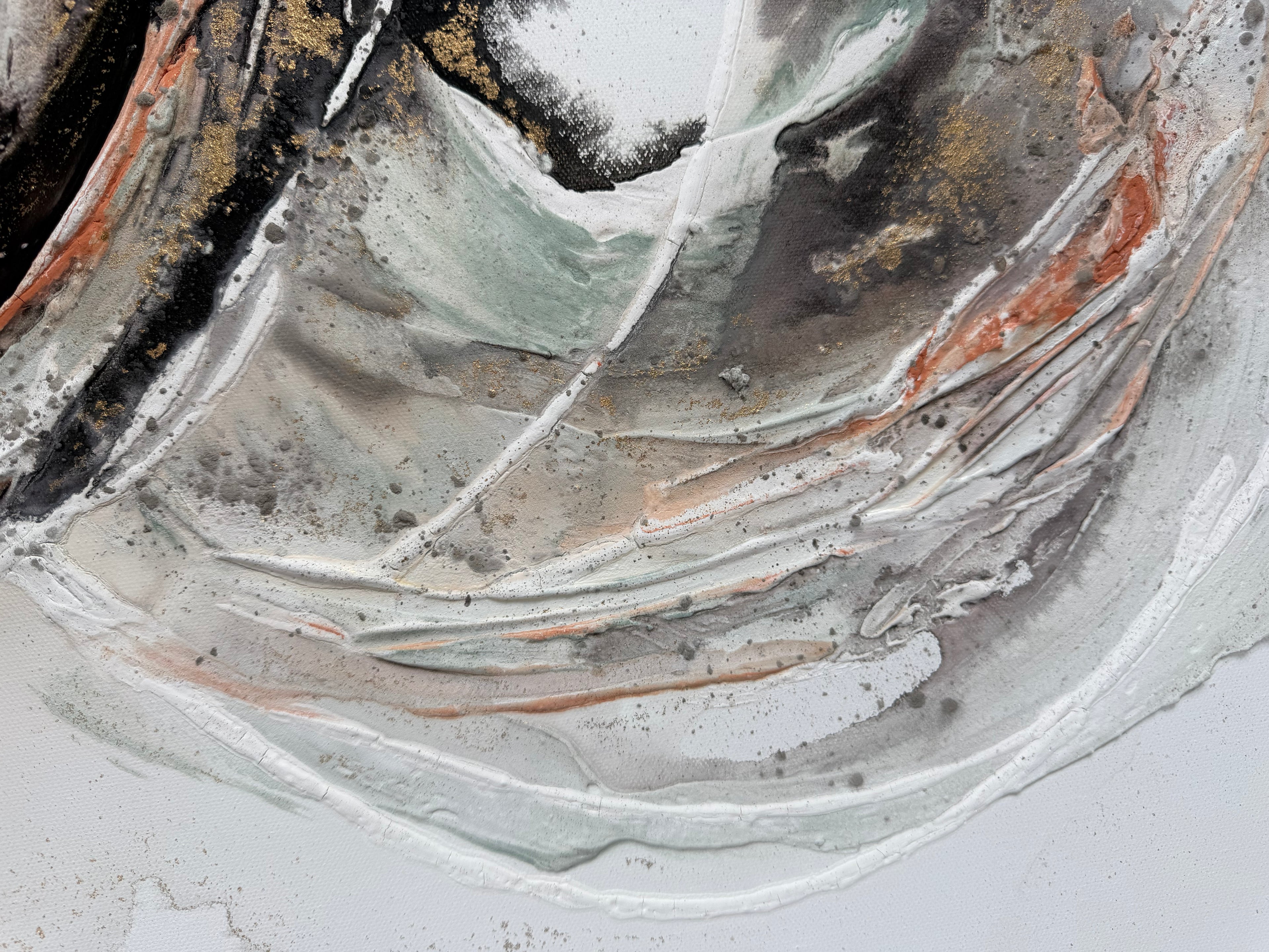 Close view of the pale grey and white sweep with coral running through Unfold