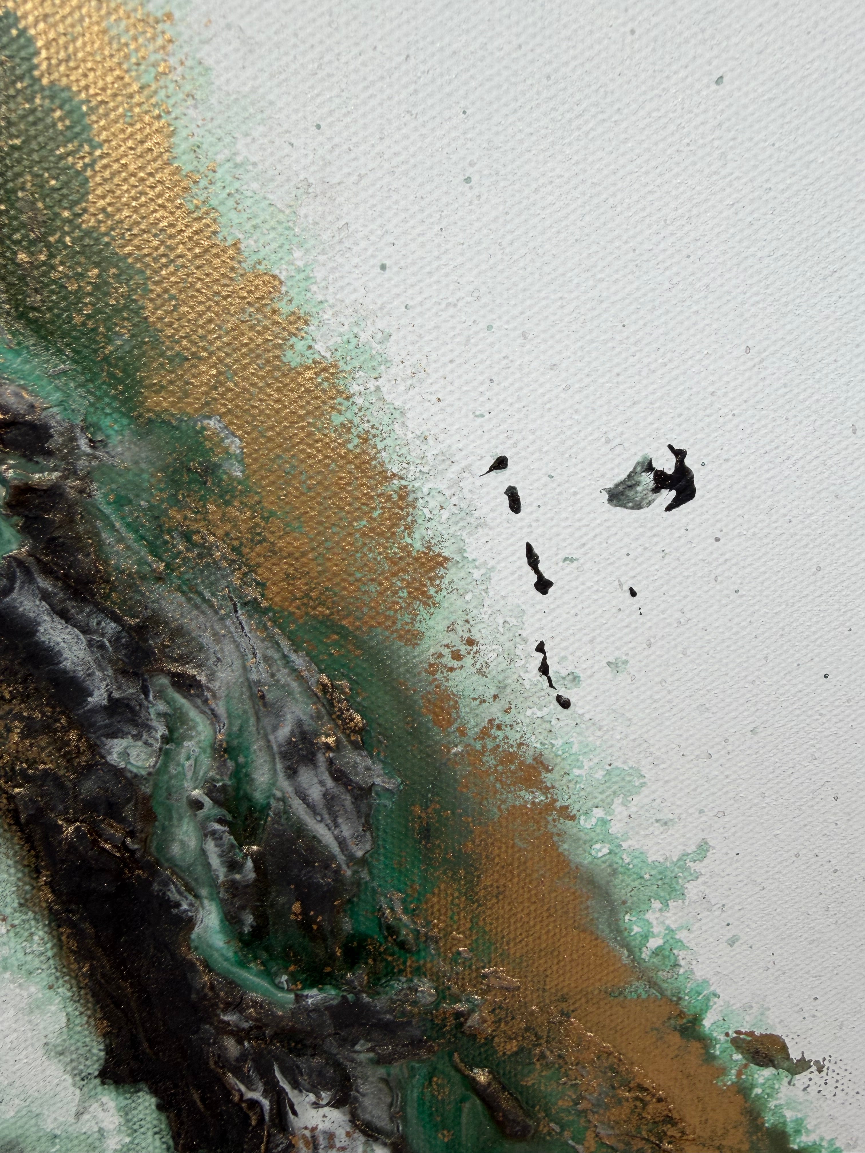 Macro of green and gold pigment scattered across the white ground of Rooted 1