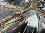 Detail of Unfold where black, coral and gold radiate out from the centre