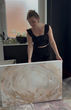 Stefanie Carola holding the original painting Peace in her Vienna studio