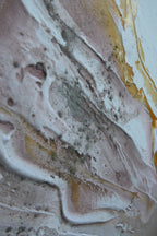 Detail of Liberation 1 showing white and gold texture with fine pink and dark speckles.