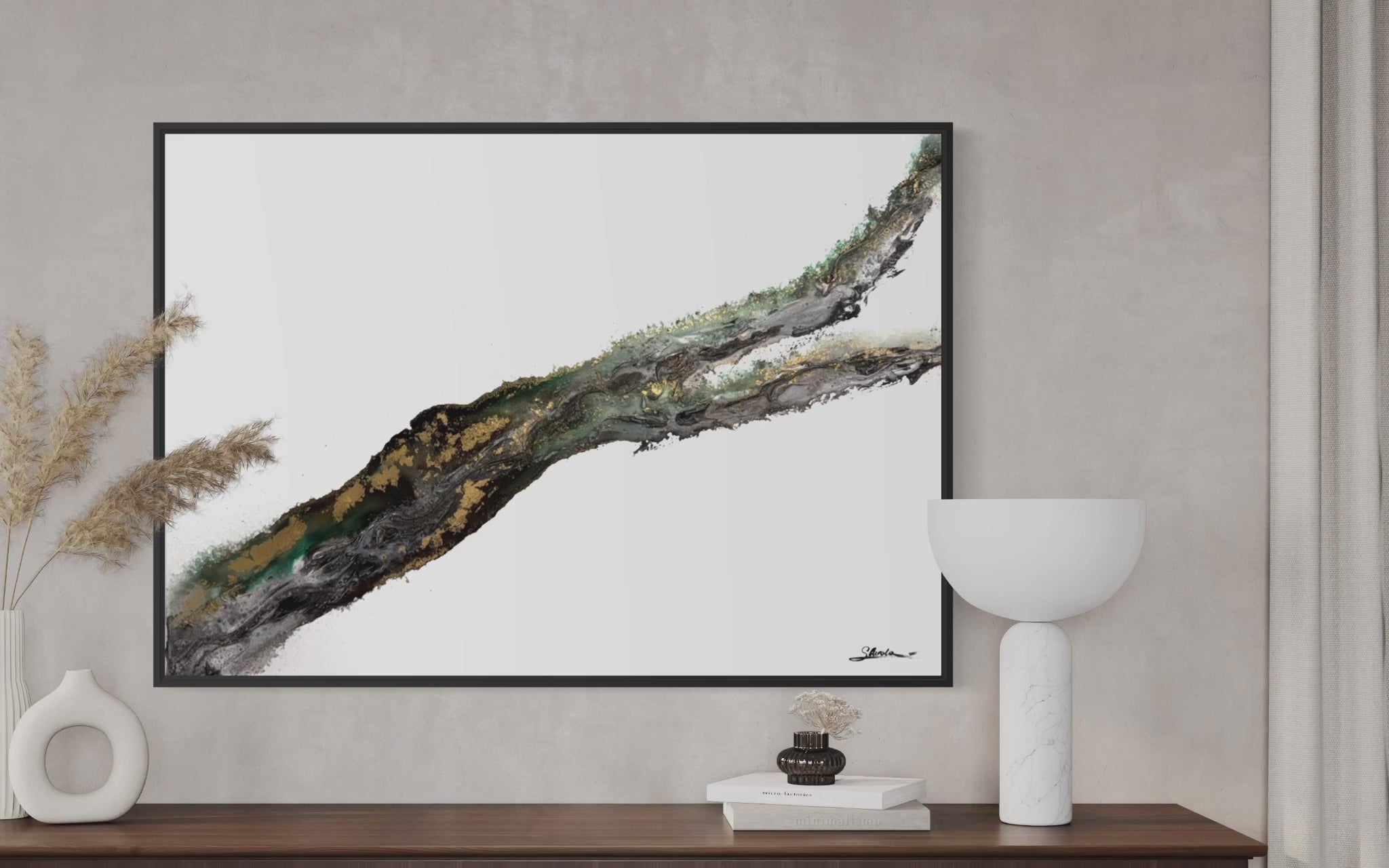 Video of Rooted 2 on a textured wall above a wooden console with a white bowl