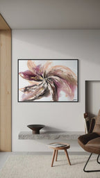 Video panning across Wildflower on a white wall beside a brown leather chair